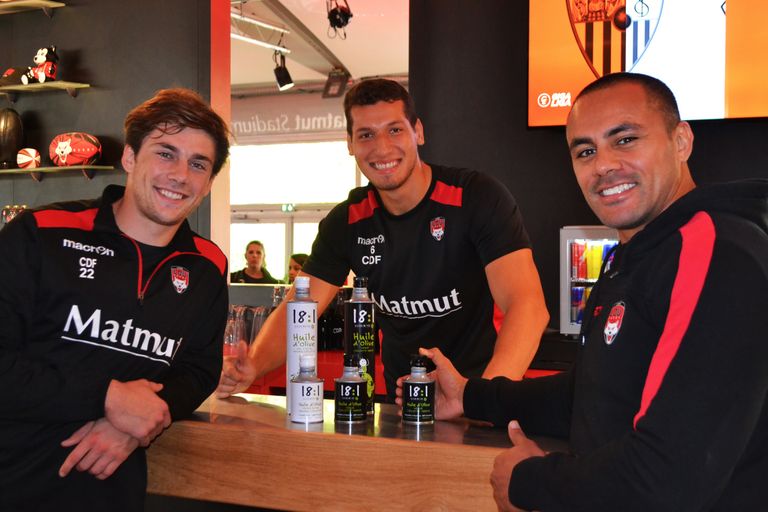 Group photo of 3 LOU Rugby players at the LOU brewery.