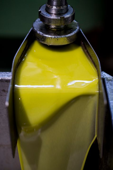 Olive oil flowing freely, fresh from the mill
